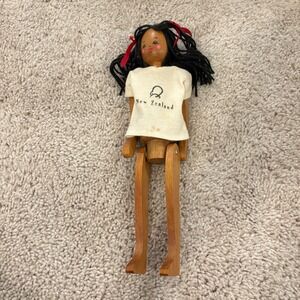 Vintage Articulated Wooden Doll "New Zealand" Shirt With Black Yarn Hair